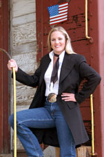 Woman wearing frock coat standing on a train